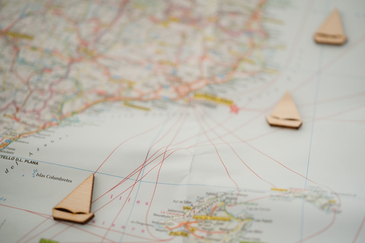 Nautical map with wooden boat markers, showing travel routes and geography. Ideal for travel planning.